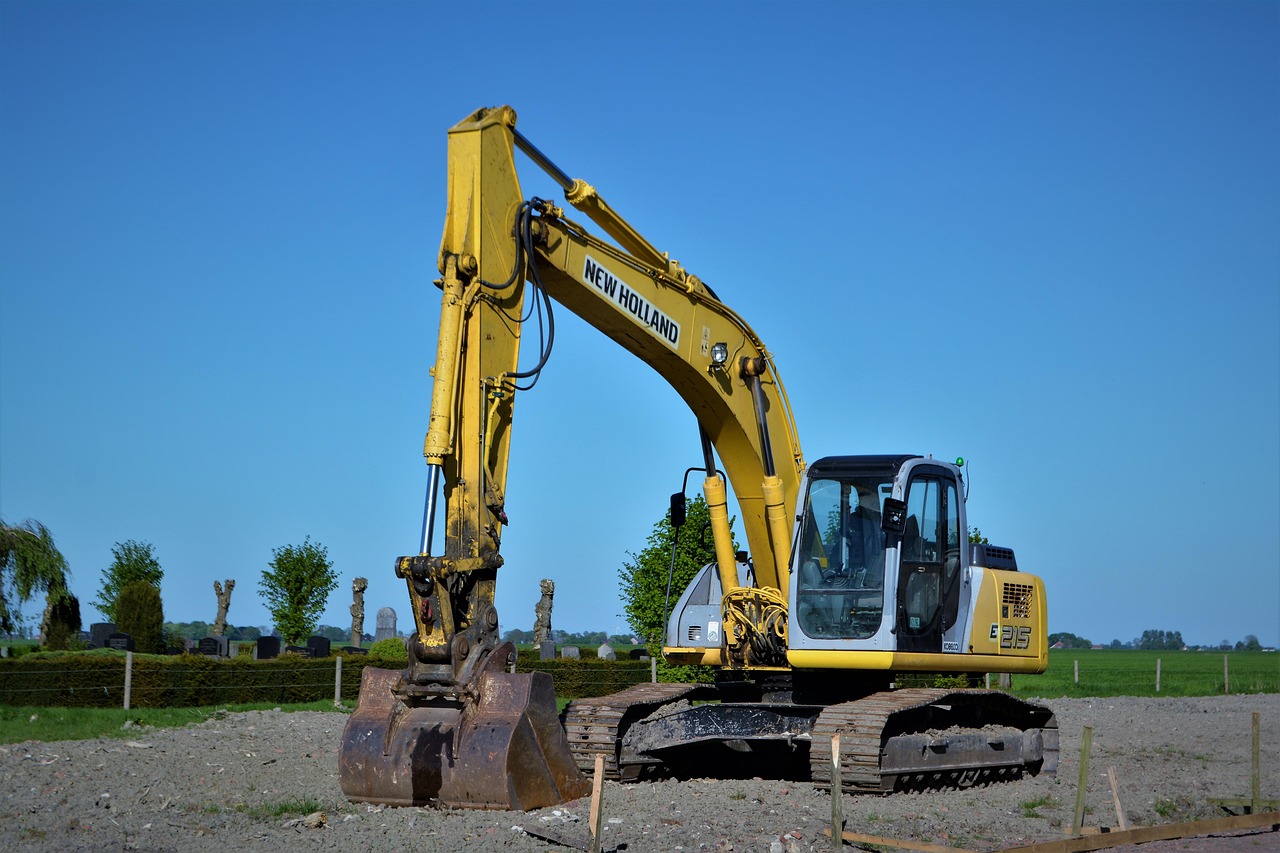 Excavator grading a lot in Coeur d'Alene, ID